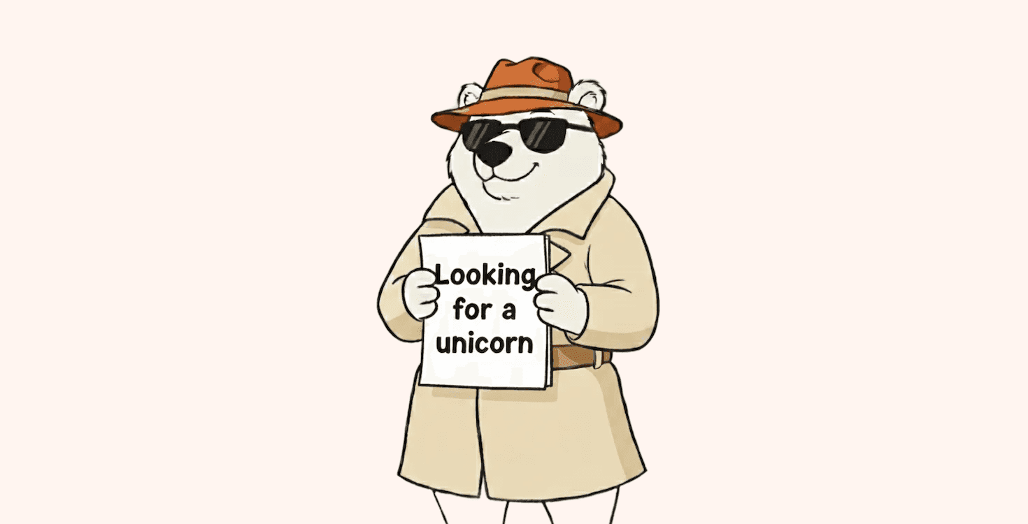 An illustration of a bear holding a sign 'Looking for a unicorn'